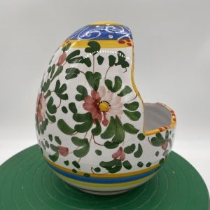 Egg-shaped container with spring decoration