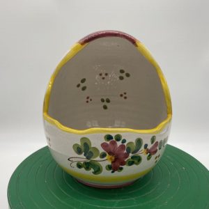 Egg-shaped container with spring flowers decoration