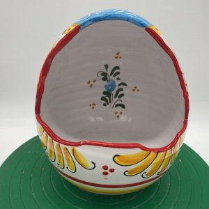 Egg-shaped container with floral decoration
