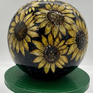 Furniture ball with sunflower decoration and black background