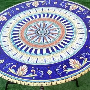 Table complete with iron base with Grotesque and Vario decoration diameter 100 cm