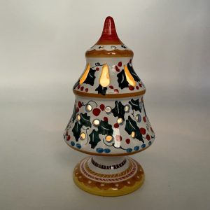 Spruce with holly decoration