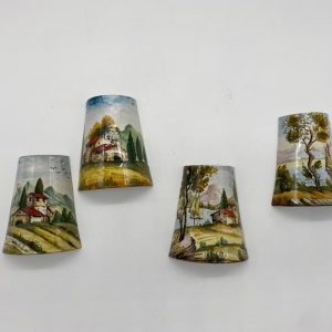 Four tiles decorated with a Tuscan landscape