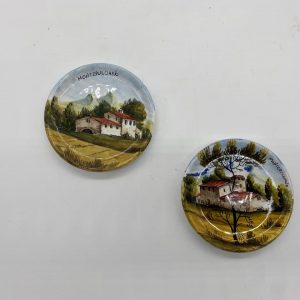 Two plates decorated with a Tuscan landscape