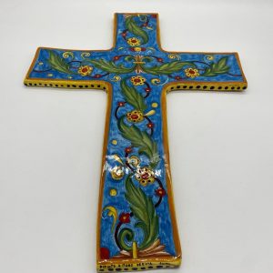 Cross with classic decoration on a sky blue background